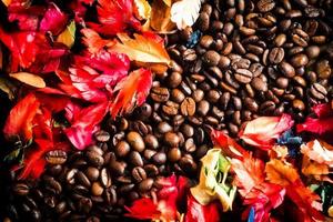 The background image is made of coffee beans decorated with flowers. background concept for coffee shop