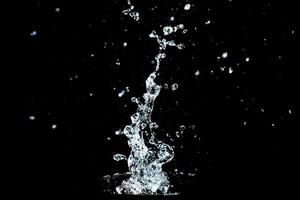 Abstract background of Water splashing on a black background. idea for freshness photo