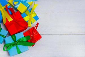 Gift boxes on wooden table. Collection of gift boxes on wooden board holidays concept. Presents for any holiday concept. photo