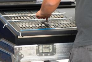 Sound engineer working on mixer photo