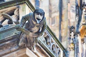 A characteristic gargoyle of St. Vitus Cathedral in Prague photo