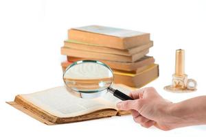 Magnifier search of old books photo