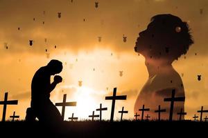 Silhouettes of men sitting and praying for blessings. hope concept  Praying for salvation from the loss of the war. Stop war, not wa photo