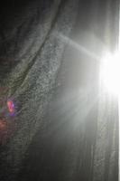 Rays of light on fabric. Re-illumination of frame. photo