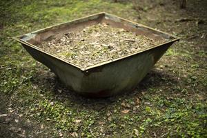 Tank with earth. Old iron in woods. photo