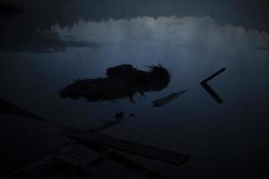 Fog before dawn on lake. View of forest and water in early morning. photo