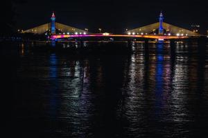 Suspension tensile structure Bridge Lighting Colorful and Bewitching Effects. Chesadabodin Bridge photo