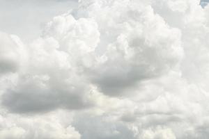 Abstract nature background with clouds in light tonality. White cumulus clouds photo