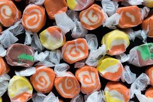 Candy corn colored Halloween wrapped candy photo