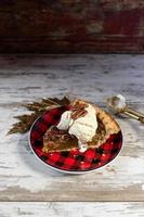 Christmas or holiday pecan pie slice with Vanilla icecream photo