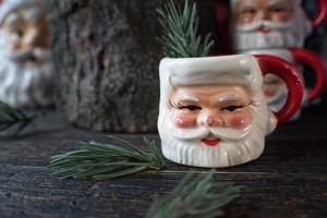 Christmas Santa Mugs in holiday setting photo