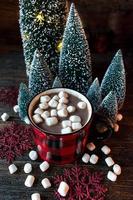 Christmas mug of hot chocolate with mini marshmallows in festive Christmas background photo