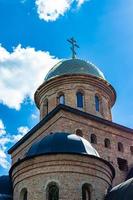 Christian church cross in high steeple tower for prayer photo