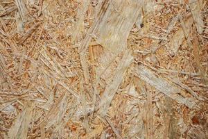 Pressed shavings. Wooden texture OSB Board. Building material for renovation. photo