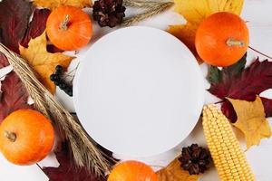 Thanksgiving cutlery setting. Festive table decor on wooden background. photo