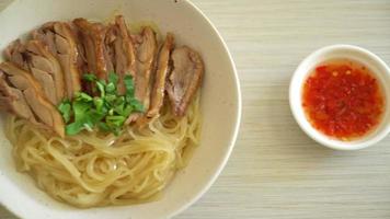 dried noodles with stewed duck in white bowl - Asian food style