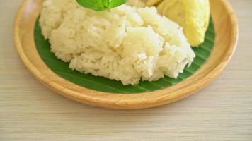 Durian with sticky rice -  sweet durian peel with yellow bean, Ripe durian rice cooked with coconut milk - Asian Thai dessert summer tropical fruit food video