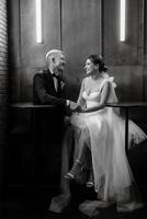 bride and groom inside a cocktail bar photo