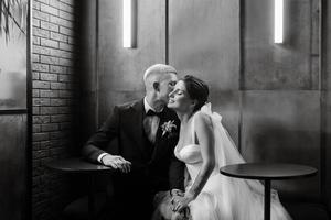 bride and groom inside a cocktail bar photo