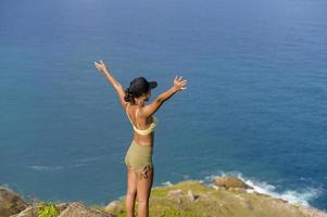 Beautiful asian woman in sportswear trekking on mountain trail, Travel and ecotourism concept. photo