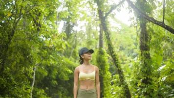 Beautiful asian woman in sportswear trekking on mountain trail, Travel and ecotourism concept. photo