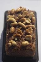 Brownies sprinkled with nuts look appetizing to eat with tea and coffee in the morning and in the coffee break is a sweet snack that is easy to eat and makes you fat. photo