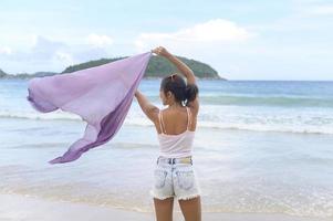 Young Beautiful woman enjoying and relaxing on the beach,  Summer, vacation, holidays, Lifestyles concept. photo