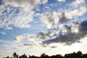 Rain clouds form in the evening in the rainy season. Brightly colored skies and clouds, rainy season, early winter - where the atmosphere warms in the evening when the sun sets on the horizon. photo