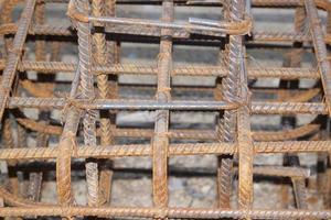 Deformed steel bars that are bending and bound to give the shape and structure to be suitable for the construction of houses, buildings that require strong, durable, firm ground of the building photo