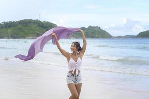 Young Beautiful woman enjoying and relaxing on the beach,  Summer, vacation, holidays, Lifestyles concept. photo