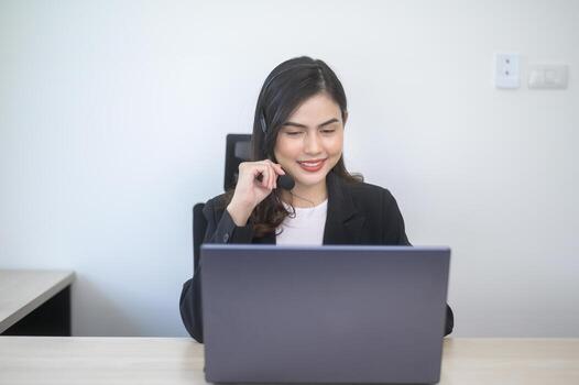 Female call center agent with headset consulting clients online, customer service and customer support operator concept photo