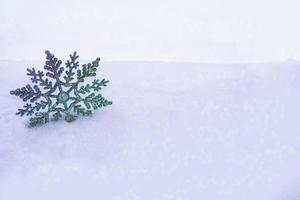 White fluffy snowflakes on snow. Winter christmas background. photo