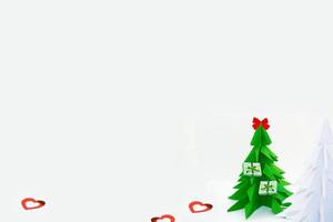 origami christmas tree isolated on white background photo