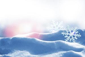 White fluffy snowflakes on snow. Winter christmas background. photo