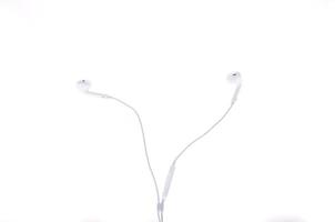 white earphones isolated on white background photo