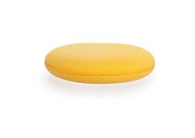 Sponge over white background. Yellow household cleaning sponge. photo