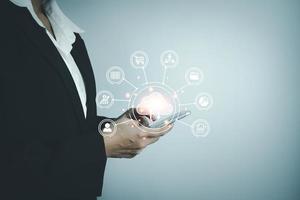 Concept global data connection with internet technology, user touch screen for online transactions by internet technology, big data, database management, cloud computing, cashless society. photo