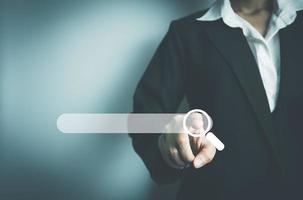 Search Engine optimization SEO concept, Businesswoman search for information on Internet, Using the search bar, Wireless Network, big data and accessing website information. photo