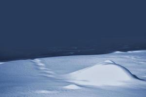 antecedentes. paisaje de invierno la textura de la nieve foto