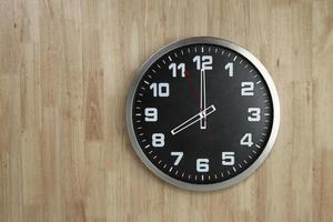 Standless Clock at 8 O'Clock, Start work at 8 PM. Isolate on wooden Background, photo