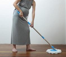 Pregnant woman work at home photo