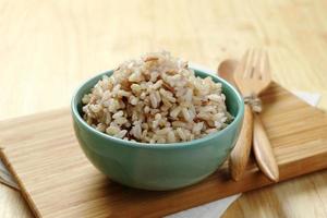 Brown Rice on Wooden Plate photo