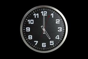 Standless Clock at 5 O'Clock, Finish work at 5 PM. Isolate on black Background, photo