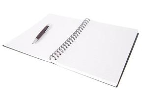 Blank open notebook lined papers with pen photo