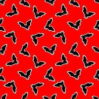 seamless pattern with bats on a red background. vector illustration