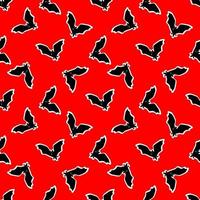 seamless pattern with bats on a red background. vector illustration