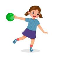 happy little girl playing bowling in the sport club ready to throw the ball vector