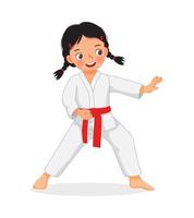 linda niña de karate con cinturón rojo que muestra técnicas de ataque de patadas en la práctica de entrenamiento de artes marciales vector