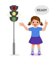 cute little girl pointing and showing traffic light indicator yellow light on vector