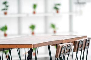 Tiny guy hang on to table rim. photo